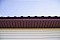 Софит металлический без перфорации 0,45 Drap с пленкой RAL 8004 терракота